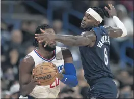  ?? KYUSUNG GONG — THE ASSOCIATED PRESS ?? Minnesota Timberwolv­es forward Jarred Vanderbilt, right, defends against Clippers forward Justise Winslow during Monday night’s preseason game in Ontario.