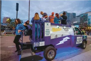  ?? IVY CEBALLO/TAMPA BAY TIMES ?? Tampa Bay Lightning fans arrive to Amalie Arena after riding the Tampa Bay ICEBOX, a “Zamboni-like ice resurfacer,” in Tampa on Jan. 25.