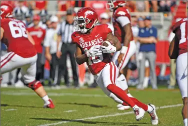  ?? Associated Press ?? Room to move: Arkansas receiver De'Vion Warren (10) runs the ball against Georgia Southern during the first half of an NCAA college football game against Georgia Southern Saturday in Fayettevil­le.