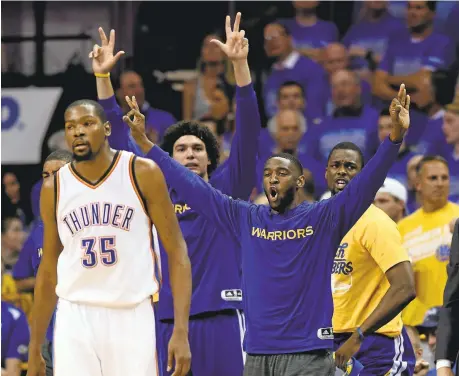  ?? JOSE CARLOS FAJARDO/STAFF ARCHIVES ?? Warriors bench players react to a 3-pointer by Klay Thompson as then-Oklahoma City star Kevin Durant walks away in Game 6 of the 2016 West finals.