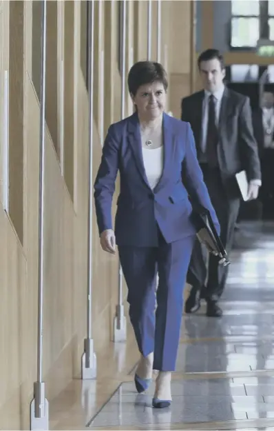  ??  ?? 0 Nicola Sturgeon arrives to deliver her statement on the road map out of lockdown at Holyrood