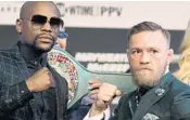  ?? JOHN GURZINSKI/AFP/GETTY IMAGES ?? Born from the internet, the boxing match between boxer Floyd Mayweather Jr., left, and MMA fighter Connor Mcgregor is Saturday night.