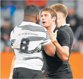  ?? Photo / Photosport ?? Fiji’s Albert Tuisue and All Black Ethan Blackadder square off.