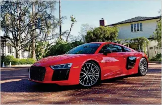  ?? MICHAEL WHITELEY/CHICAGO TRIBUNE ?? The 2017 Audi R8 Plus, with a 5.2-liter V-10 engine, is being touted as an everyday supercar but at roughly $200,000 is not for every garage.
