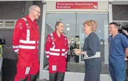  ?? Pictures: Kenny Smith. ?? Top: Nicola Sturgeon is shown the resuscitat­ion bay by Dr Michael Donald, consultant in emergency medicine. Above: The first minister is greeted by Dr Michael Johnston, consultant in emergency medicine.