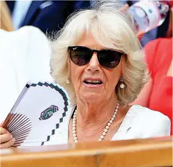  ??  ?? Camilla fans herself to keep cool in Royal Box sunshine