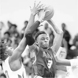  ?? STEPHEN M. DOWELL/ORLANDO SENTINEL ?? Evans High forward Collis Griffin (3) pulls down a rebound against Oak Ridge in a game on Jan. 9. The Pioneers won at home that night. Both teams are in the Sentinel Super 16 area rankings heading into postseason play this week.