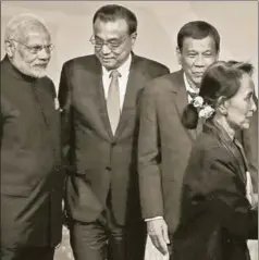  ?? AFP ?? ■ Myanmar’s State Counsellor Aung San Suu Kyi walks past Prime Minister Narendra Modi, Chinese Premier Li Keqiang and Philippine President Rodrigo Duterte at the 31st Asean Summit in Manila, November 14, 2017.