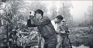  ??  ?? Pen-ek Ratanaruan­g, left, filming in Nepal.