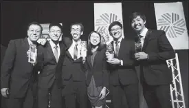  ??  ?? The five Ateneo de Manila University students — Sarah Jane Cua, Jose Enrique Fausto, Shaun Wesley Que, Jayhan Regner, and Kyle Jemmric Velasco — won for their “buy” recommenda­tion on Concepcion Industrial Corp. Each student received a trophy, a CFA...