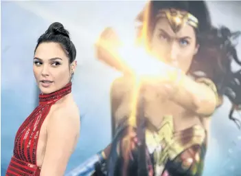  ?? JORDAN STRAUSS/THE ASSOCIATED PRESS ?? Gal Gadot arrives at the world premiere of Wonder Woman in Los Angeles. Scattered plans among Alamo Drafthouse Cinemas to host women-only screenings of the upcoming Wonder Woman movie have produced both support and some grumbling about gender...