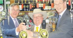  ??  ?? Alan ‘Howling Laud’ Hope, centre, with his local MPs Sir Gerald Howarth, left, and James Arbuthnot at the official launch of the Winning Co’ALE’ition beer in the Strangers’ Bar of the Houses of Parliament.