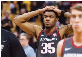  ?? (AP/L.G. Patterson) ?? Arkansas forward Reggie Chaney walks off the court after the Razorbacks’ 83-79 loss in overtime to Missouri on Saturday in Columbia, Mo. Chaney scored 17 points and grabbed 11 rebounds.