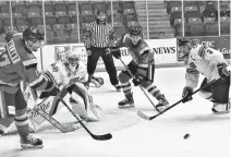  ?? RICHARD MACKENZIE • SALTWIRE NETWORK ?? Leon Denny, from Eskasoni Mi’kmaw Nation, looks to block a pass between Crushers’ attackers during a Truro-pictou County battle from earlier this season. Denny, who won a title with the Bearcats in the 2016-17 season, is wearing the C for this year’s team.