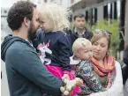  ?? ADRIAN LAM, TC ?? Tim Zemanek has a moment with daughter Ilsa, wife Kate and daughter Teagan at Madrona on Wednesday. The family is moving into one of the units.