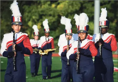  ?? Erik Trautmann / Hearst Connecticu­t Media file photos ?? The Brien McMahon High School Marching Band performs its halftime field show as Norwalk High School hosts The Cavalcade of Bands on Oct. 12, 2019.