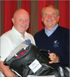  ??  ?? Pat McAuley is presented with the Vice-Captain’s Prize for second place on Captain’s Prize Day by L&B Vice-Captain Bryan Collins.