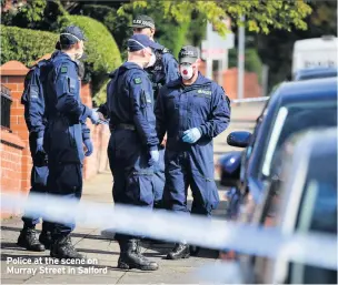  ??  ?? Police at the scene on Murray Street in Salford