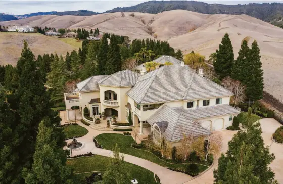  ?? THE AGENCY ?? In 2021, Taso Tsakos broke the record for the highest-priced sale in Blackhawk Country Club with the sale of 4499 Deer Ridge Road for $7.6 million.