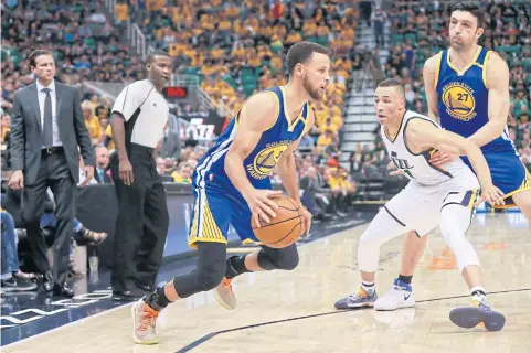  ?? USA TODAY SPORTS ?? Warriors guard Stephen Curry controls the ball against Jazz guard Dante Exum during the third quarter of Game Four.