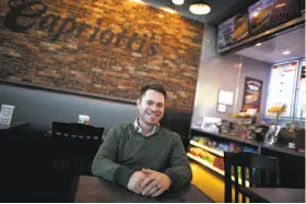  ?? Photos by Isaac Brekken / New York Times ?? Jason Smylie, chief marketing officer of Capriotti’s, says the sandwich shop chain will release a loyalty app, below, that will expand its rewards program.