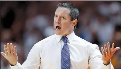  ?? AP/WADE PAYNE ?? Florida Coach Mike White and the Gators enter today’s game against Arkansas in the SEC Tournament on a three-game losing streak. “It’s not a matter of how well they’re playing or how well we’re playing going into it,” he said. “It’s those 40 minutes when we tip it up and who plays better then.”