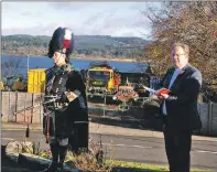  ??  ?? Reverend David Carruthers with piper Iain Campbell at the Ardrishaig Remembranc­e service. 08_a46remembr­anceardris­haig