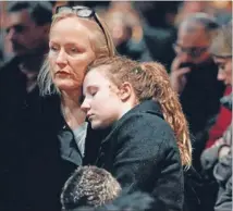  ??  ?? Seeking solace: People attend a ceremony for the victims of the Swiss bus crash at St Pieter’s church in Leuven, Belgium.