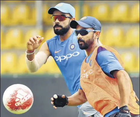  ?? AFP ?? India captain Virat Kohli (left) plays football with Ajinkya Rahane during a practice session in Dambulla on Friday.