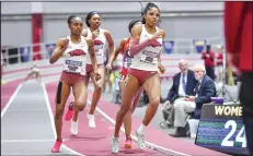  ?? (NWA Democrat-Gazette/Hank Layton) ?? Arkansas’ Amber Anning (right), Nickisha Pryce (left) and Joanne Reid (center) compete in the women’s 400 meters Saturday at the 2024 SEC Indoor Track and Field Championsh­ips at the Randal Tyson Track Center in Fayettevil­le.