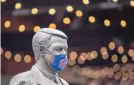  ?? JOSE F. MORENO/ASSOCIATED PRESS ?? A statue of Harry Kalas at Philadelph­ia’s Citizens Bank Park sports a face mask as MLB’s opening day approaches. Fans will be subject to COVID-19 protocols.