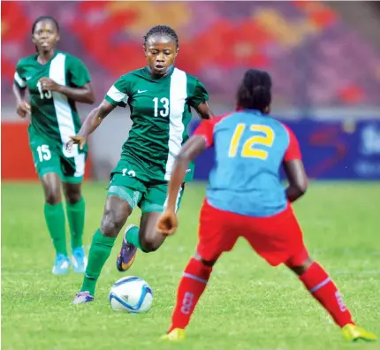  ?? PHOTO Macjohn Akande ?? Onyebuchi Ihuoma Goodness of Nigeria being challenged by Feza Ndaya Farida of RDC Congo during the FIFA U - 20 Women’s World Cup qualifier at the National Stadium in Abuja on Saturday.