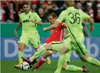  ?? AP ?? Bayern’s Philipp Lahm (in red) scores against Augsburg. —