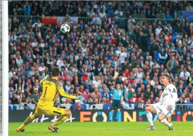  ?? FRANCISCO SECO / AP ?? Real Madrid's Cristiano Ronaldo fails to score against Tottenham goalkeeper Hugo Lloris during Tuesday’s Champions League clash at Santiago Bernabeu stadium in Madrid. The Group H game ended 1-1.