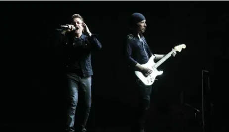  ?? STEVE RUSSELL/TORONTO STAR ?? Bono and The Edge on stage at the Rogers Centre. U2’s full-album Joshua Tree tour is extremely popular, already pulling in $62 million (U.S.) for the group.