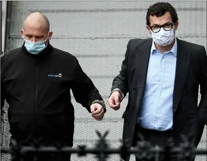  ??  ?? Simon Bowes-lyon, the Earl of Strathmore, right, leaves court in handcuffs after being sentenced to 10 months for sexual assault