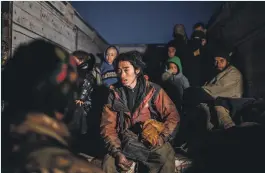  ?? AFP ?? A suspected ISIS member waits to be searched by members of the Syrian Democratic Forces after fleeing Baghouz