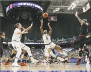  ?? Chuck Burton / Associated Press ?? Notre Dame’s Jackie Young shoots against Louisville during the first half of the ACC tournament final on March 10.