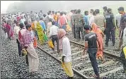  ?? HT PHOTO ?? A crowd gathered at Adalpur Halt in Munger district of Bihar after four women were run over by a train on Monday.