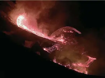  ?? Associated Press ?? Lava flows within the Halemaumau crater of the Kilauea volcano Sunday on Hawaii’s Big Island.
