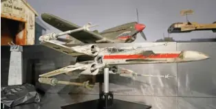  ?? ?? A miniature model called “Red Leader,” an X-wing starfighte­r from the 1977 film “Star Wars: Episode IV — A New Hope,” is displayed Aug. 30 at Heritage Auctions in Irving, Texas.