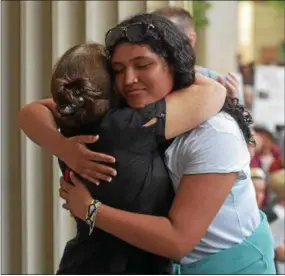  ?? PETE BANNAN – DIGITAL FIRST MEDIA ?? Sofia Soto, a 2018 graduate of Kennett High School, is embraced by Lisa Teixeira after Soto told the emotional story of her father’s detention by immigratio­n officials.