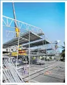 ?? Photo / Tania Whyte ?? Scaffoldin­g surrounds the iconic Riverbank Centre in preparatio­n for the new roof.