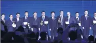  ?? ZOU HONG / CHINA DAILY ?? Winners and presenters of leading internet technology prize pose at a ceremony during the 4th World Internet Conference in Wuzhen, Zhejiang province on Sunday.