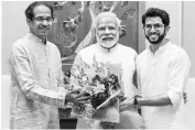  ?? PHOTO:PTI ?? Prime Minister Narendra Modi with Maharashtr­a Chief Minister Uddhav Thackeray and his son and State minister Aaditya Thackeray in New Delhi