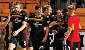  ??  ?? Jam on top: Thistle players hail Edwards for his wonder goal