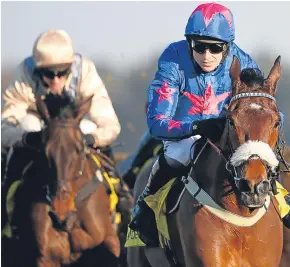  ?? Picture: Getty Images. ?? Paddy Brennan drives Cue Card on to victory in the Betfair Ascot Steeple Chase on Saturday. Colin Tizzard’s 11-year-old stayed on course for a tilt at the Cheltenham Gold Cup next month with an impressive 15-lengths win over Shantou Flyer.