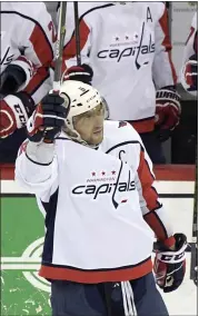  ?? BILL KOSTROUN — THE ASSOCIATED PRESS ?? Washington left wing Alex Ovechkin celebrates his 700th career goal during the third period of Saturday’s game.
