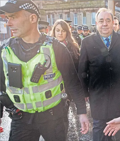  ??  ?? Former First Minister Alex Salmond arrives at the High Court in Edinburgh with a police escort as the trial over attempted rape and sexual assault charges begins. He denies all the charges