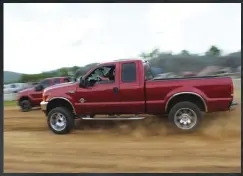  ??  ?? Making the trip up from Liberty, North Carolina, Dustin Lowe put his clean Super Cab Super Duty through its paces in the dirt drags. On top of competing in the two-wheel drive class, he would also run in the Open/modified category.